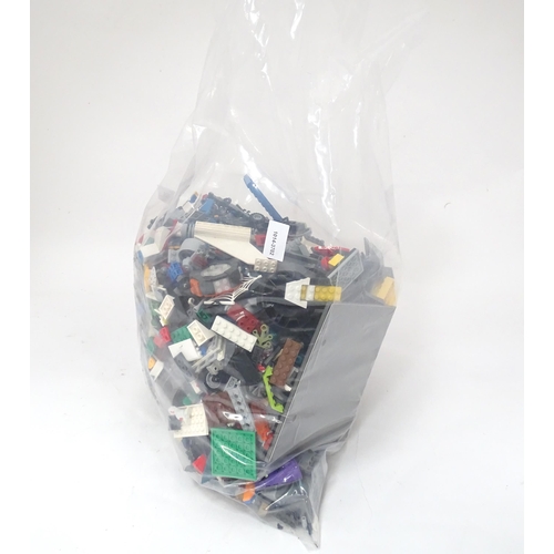 694 - A quantity of Lego to include bricks, wheels and figures etc.