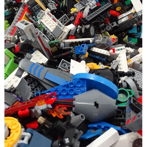 694 - A quantity of Lego to include bricks, wheels and figures etc.
