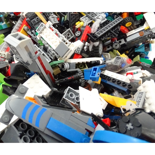 694 - A quantity of Lego to include bricks, wheels and figures etc.