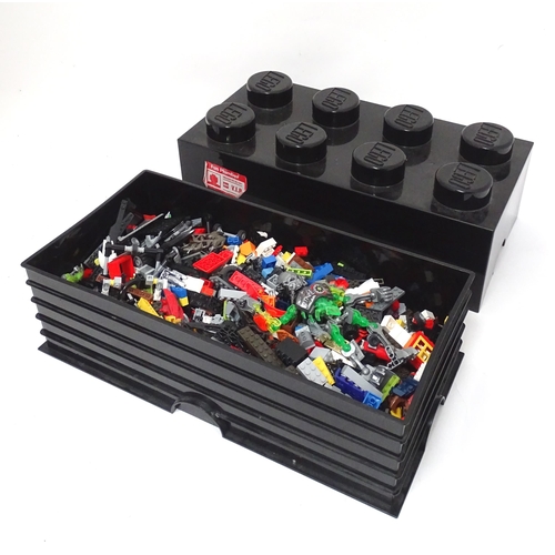 772 - Toys: A quantity of Lego to include bricks, wheels and figures etc. Within a Lego brick storage box.