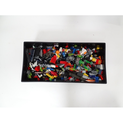 772 - Toys: A quantity of Lego to include bricks, wheels and figures etc. Within a Lego brick storage box.