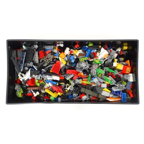 772 - Toys: A quantity of Lego to include bricks, wheels and figures etc. Within a Lego brick storage box.