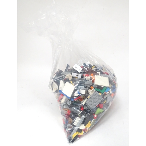 789 - Toys: A quantity of Lego to include bricks, wheels and figures etc.