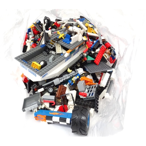 835 - Toys: A quantity of Lego to include bricks, wheels and figures etc.