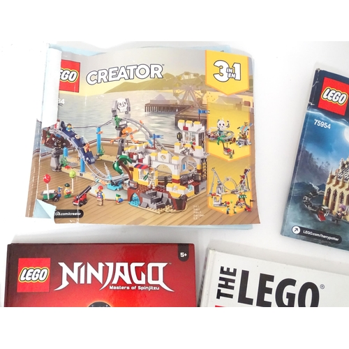 857 - A quantity of Lego books, leaflets, instruction manuals etc. to include The Lego Ideas Book, Ninjago... 