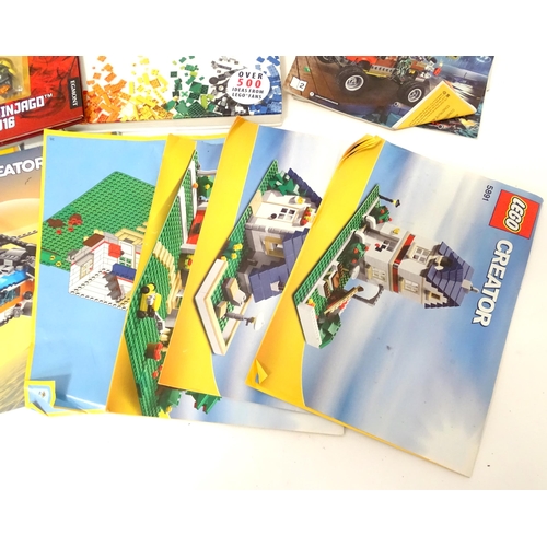 857 - A quantity of Lego books, leaflets, instruction manuals etc. to include The Lego Ideas Book, Ninjago... 