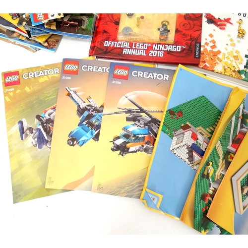 857 - A quantity of Lego books, leaflets, instruction manuals etc. to include The Lego Ideas Book, Ninjago... 