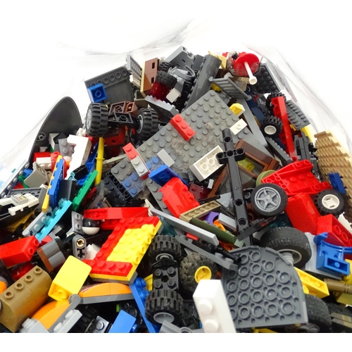 873 - A quantity of Lego to include bricks, wheels and figures etc.