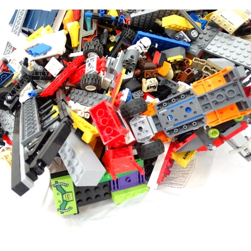 894 - A quantity of Lego to include bricks, wheels and figures etc.