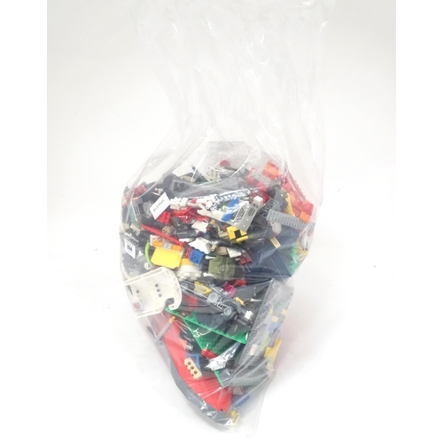 894 - A quantity of Lego to include bricks, wheels and figures etc.