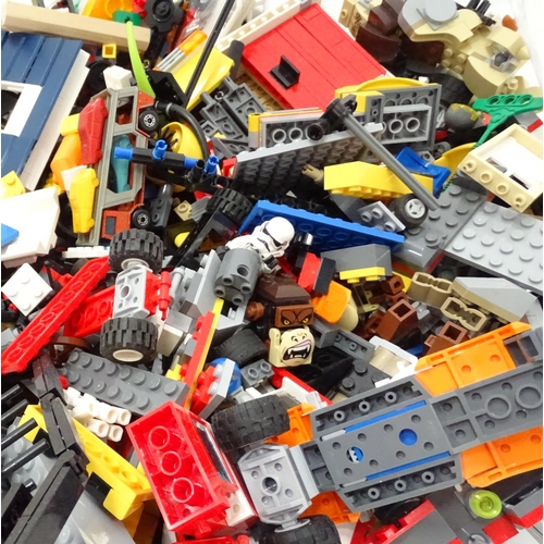 894 - A quantity of Lego to include bricks, wheels and figures etc.