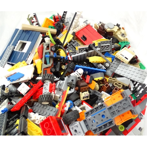 894 - A quantity of Lego to include bricks, wheels and figures etc.