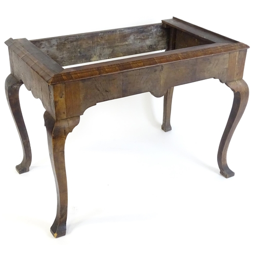 656 - An 18thC walnut cabinet / chest stand, the carved apron standing on four shaped cabriole legs, appro... 