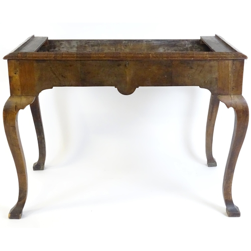 656 - An 18thC walnut cabinet / chest stand, the carved apron standing on four shaped cabriole legs, appro... 