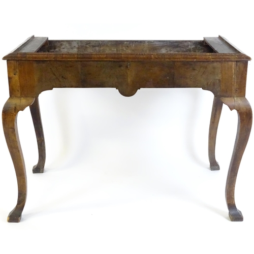 656 - An 18thC walnut cabinet / chest stand, the carved apron standing on four shaped cabriole legs, appro... 