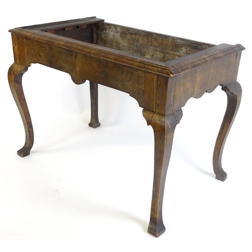 656 - An 18thC walnut cabinet / chest stand, the carved apron standing on four shaped cabriole legs, appro... 