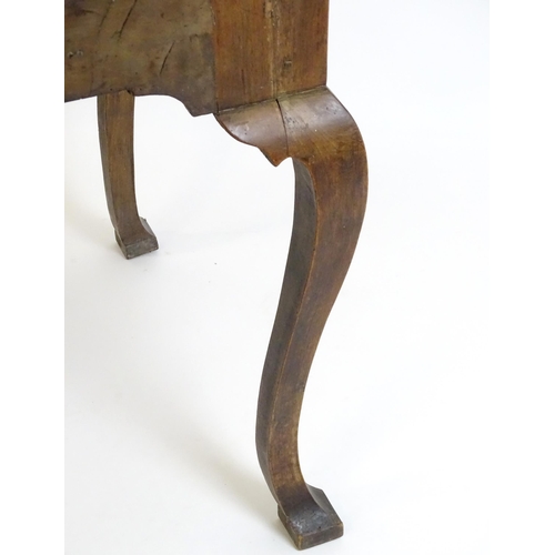 656 - An 18thC walnut cabinet / chest stand, the carved apron standing on four shaped cabriole legs, appro... 