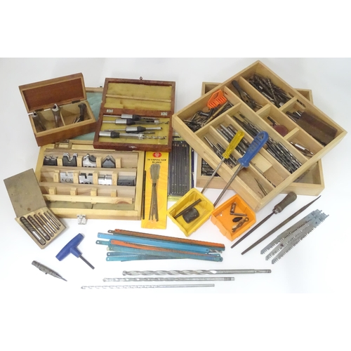 831 - A large quantity of carpentry / woodworking drill bits , coping saw blades , tools etc to include bo... 