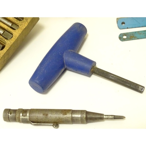 831 - A large quantity of carpentry / woodworking drill bits , coping saw blades , tools etc to include bo... 