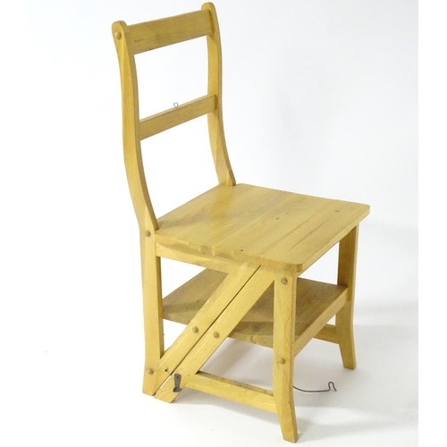 890 - A contemporary metamorphic library step chair, approx 35