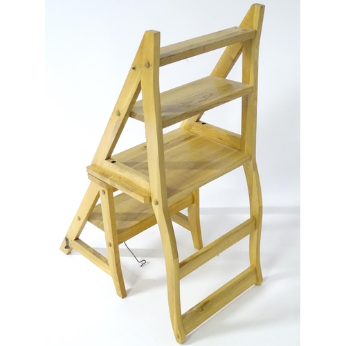 890 - A contemporary metamorphic library step chair, approx 35