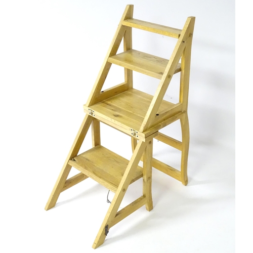 890 - A contemporary metamorphic library step chair, approx 35