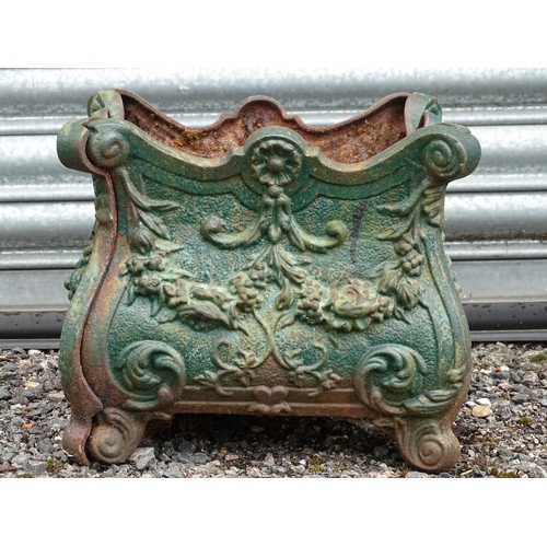 904 - Garden & Architectural : a cast iron planter of classical form with shell and swag detail, approx 13... 