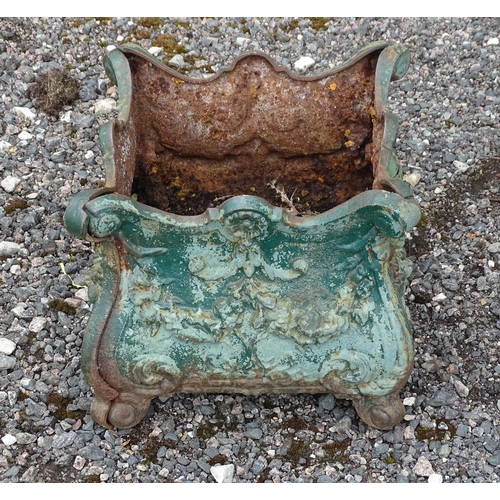 904 - Garden & Architectural : a cast iron planter of classical form with shell and swag detail, approx 13... 