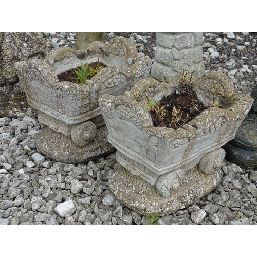 906 - Garden & Architectural : six decorative reconstituted stone garden ornaments, comprising two planter... 