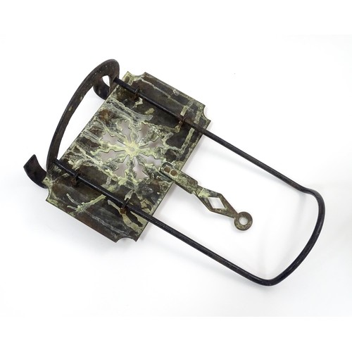 419 - A Victorian brass and cast iron sliding fireside trivet with hanging hooks and pierced detail. Appro... 