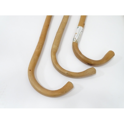 327 - Three crook handled beech walking sticks, together with a Featherwate shooting stick, a leather ridi... 