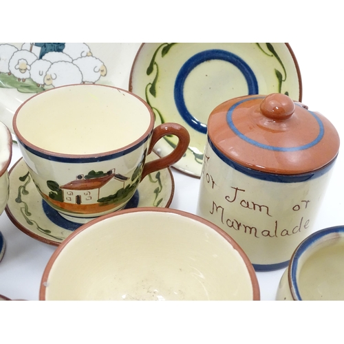 43 - A quantity of assorted motto ware to include examples by Dartmouth pottery, Longpark Torquay, etc.