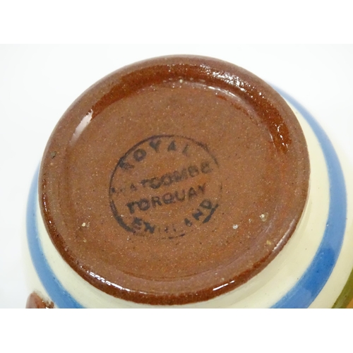 43 - A quantity of assorted motto ware to include examples by Dartmouth pottery, Longpark Torquay, etc.