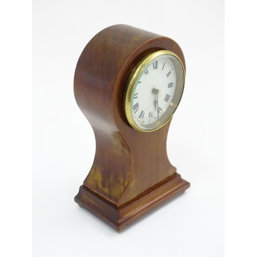 44 - A mahogany cased balloon mantle clock with French movement. Approx. 9