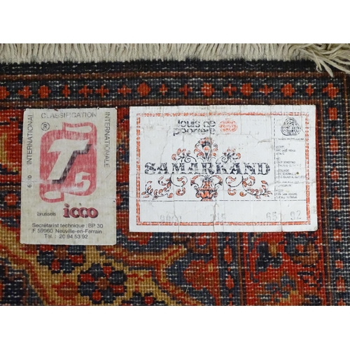 697 - Carpet / Rug : A Louis de Poortere Samarkand blue ground rug with geometric detail. Approx. 38