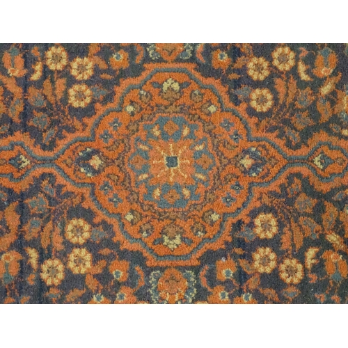 697 - Carpet / Rug : A Louis de Poortere Samarkand blue ground rug with geometric detail. Approx. 38