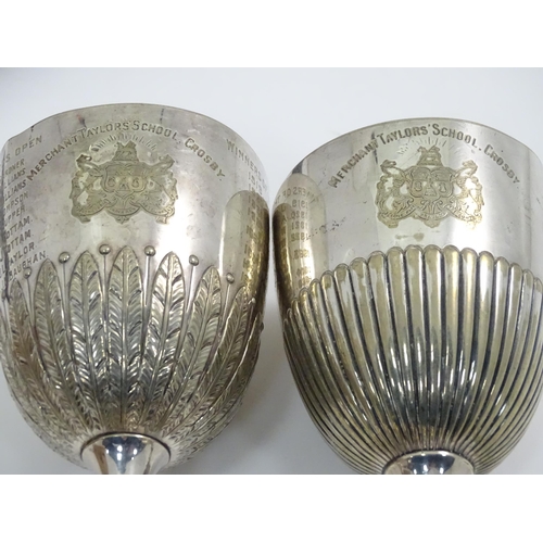 863 - A quantity of assorted silver plate / metal wares to include napkin rings, fish servers, trophy cups... 