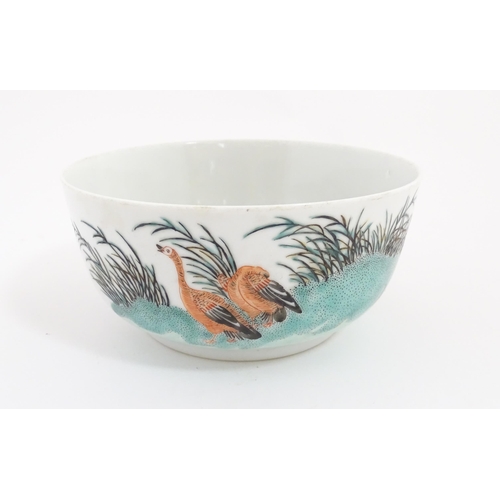 25 - A Chinese bowl decorated with geese in a landscape. Character marks under. Approx. 2 3/4