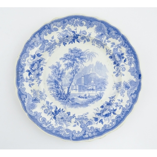 77 - A 19thC Davenport blue and white plate depicting a Rhine river view with figures, and mountains beyo... 