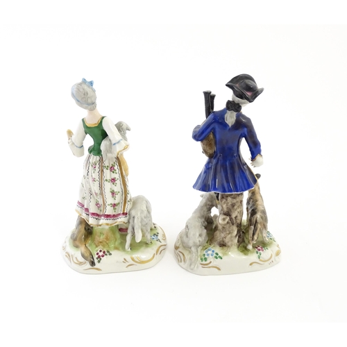 136 - A pair of German figures comprising Shepherd and Shepherdess. Marked under.  Approx. 6 1/2