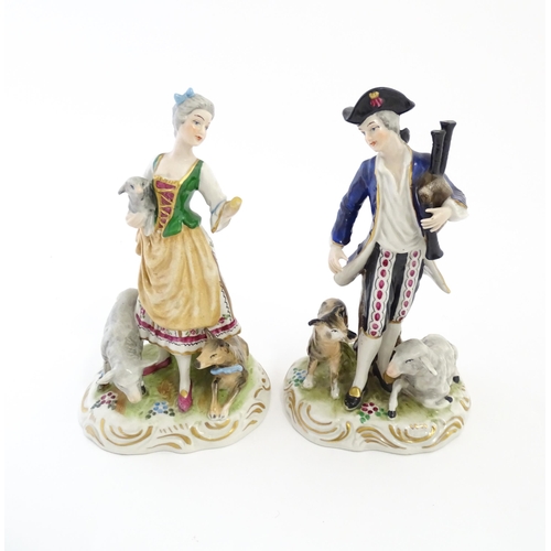 136 - A pair of German figures comprising Shepherd and Shepherdess. Marked under.  Approx. 6 1/2