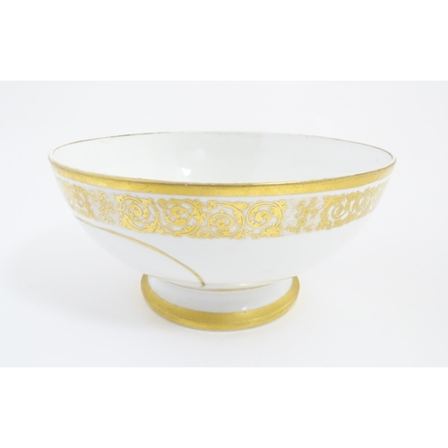 204 - An English pedestal bowl with hand painted sailing ship vignette and gilt scrolling foliate border. ... 