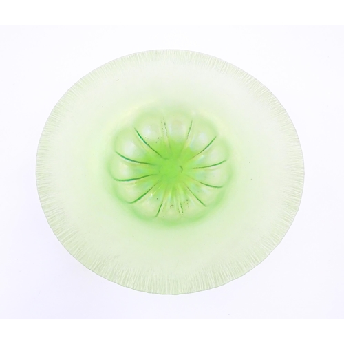 300 - A pale green lustre glass bowl with lobed centre and textured rim. Approx. 12 1/2