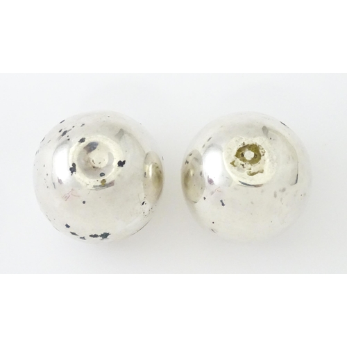 390 - A pair of Victorian silver pepperettes of egg form. Hallmarked London 1883 maker William Hutton & So... 
