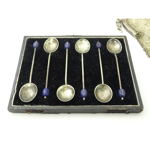 583 - A quantity of assorted silver plate items to include marrow scoop, coffee bean spoons, tongs, ashtra... 