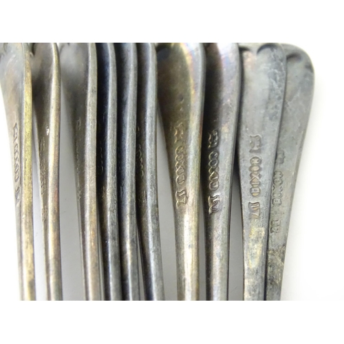 583 - A quantity of assorted silver plate items to include marrow scoop, coffee bean spoons, tongs, ashtra... 