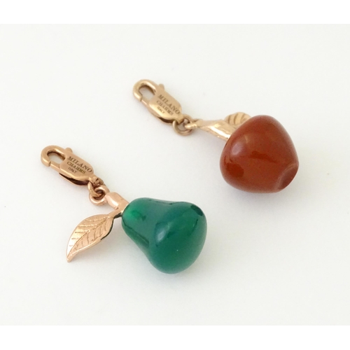 736 - Two novelty silver gilt pendant charms modelled as fruit comprising a red jasper apple and green ony... 