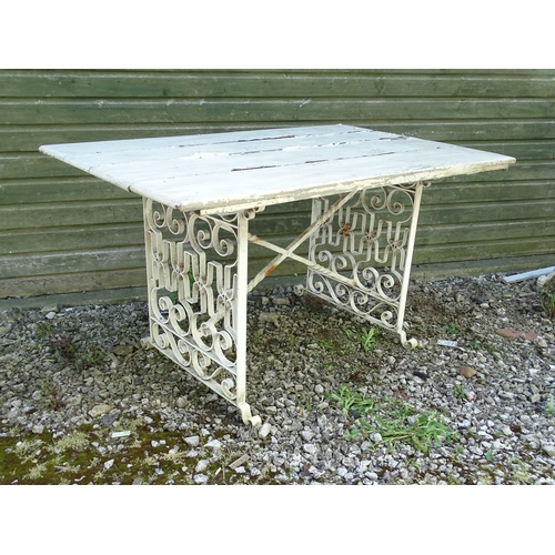 828 - Garden / Architectural: a wrought iron table with painted wooden top, approx 54