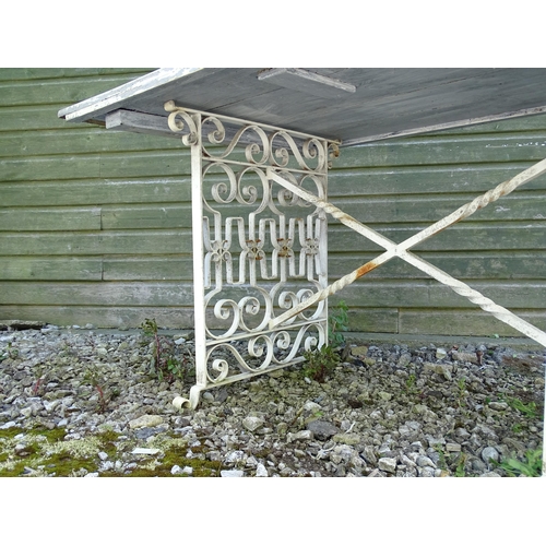 828 - Garden / Architectural: a wrought iron table with painted wooden top, approx 54