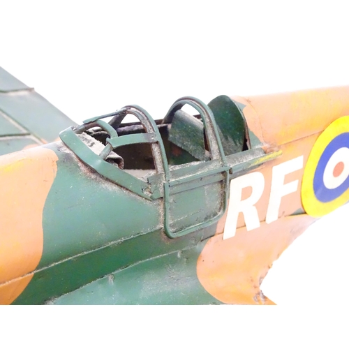 847 - Toy: A 20thC scratch built tin plate scale model of a spitfire. Approx. 18